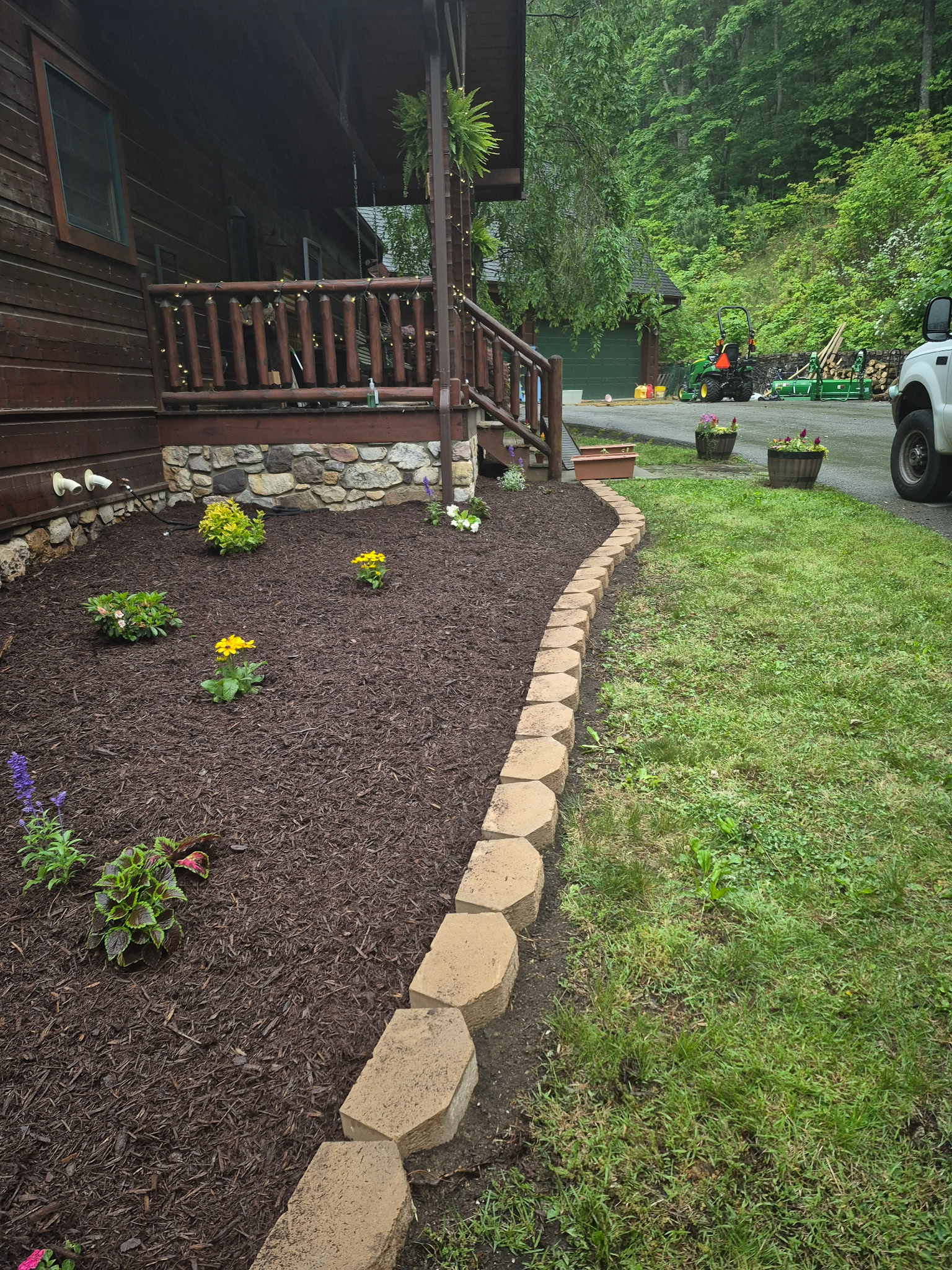 Mulch: Fresh dark mulch installation and garden bed maintenance.