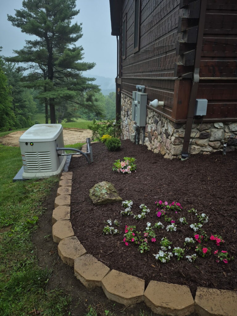 Fresh dark mulch installation and garden bed maintenance.