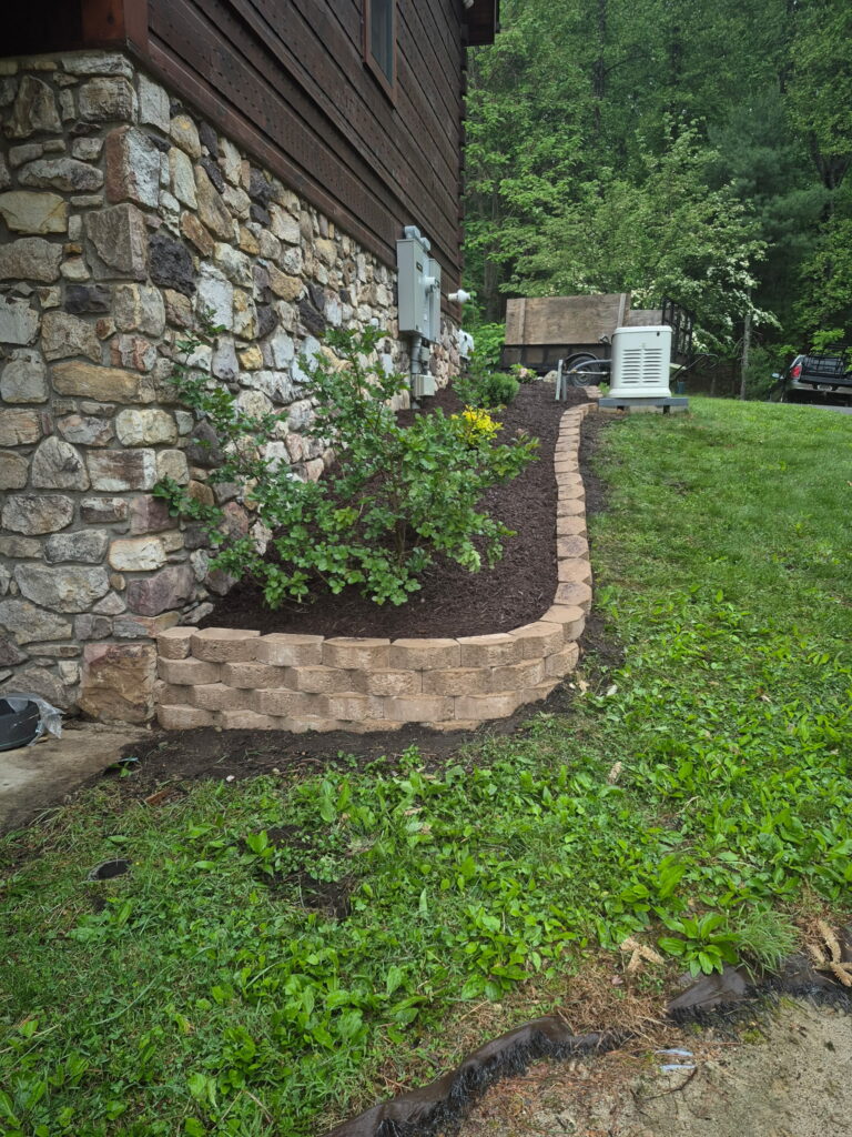 Professional stone retaining wall installation in Roanoke VA by Lopez Landscaping.