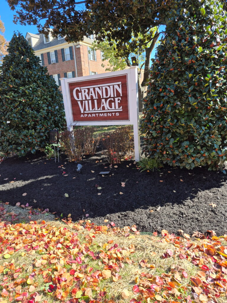 Fresh dark mulch installation and garden bed maintenance.